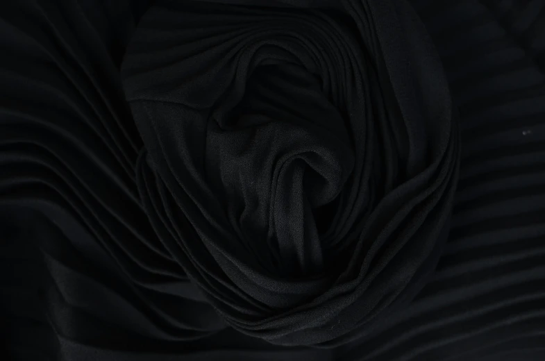 a close up shot of a black fabric, a picture, inspired by Pierre Soulages, deviantart, baroque, black rose, folds of fabric, detailed product image, bottom - view