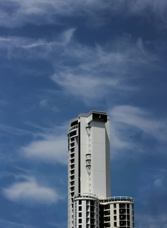 a tall building sitting on top of a lush green field, inspired by Victor Enrich, unsplash, brutalism, hotel room, stratosphere, ignant, icon