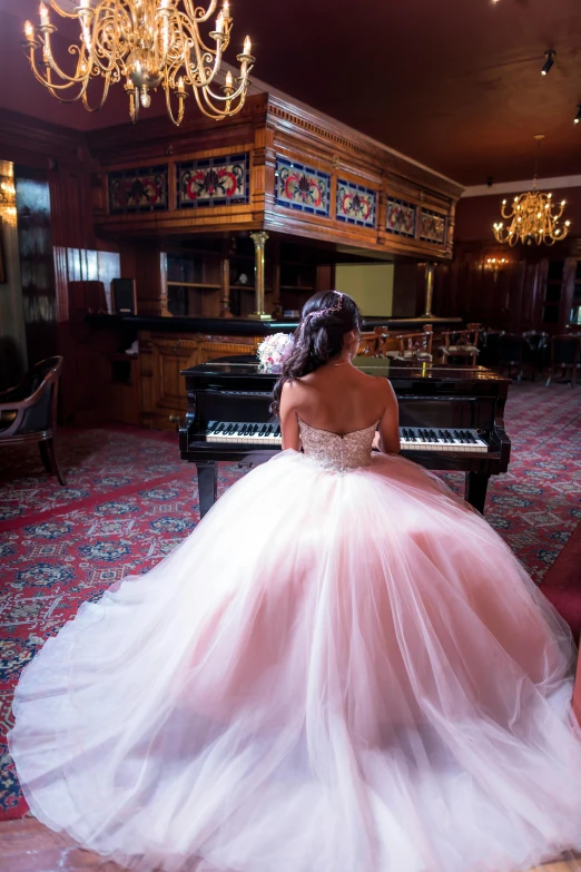 a woman in a wedding dress sitting at a piano, castle setting, pink tutu, inside a grand ornate room, facing away