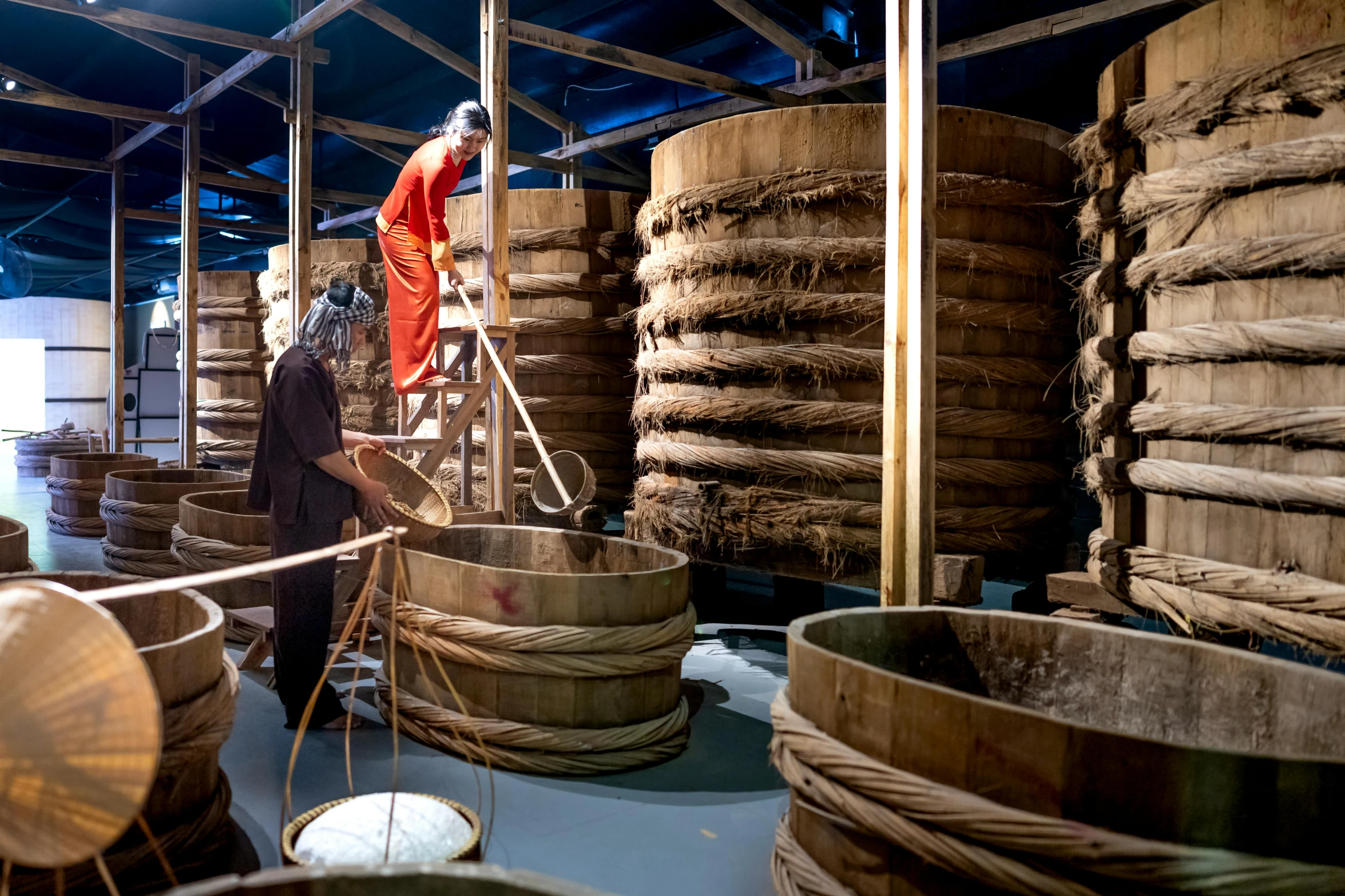 a man standing on a ladder in a room filled with wooden barrels, inspired by Fu Baoshi, process art, seafood in preserved in ice, avatar image, production photo, thumbnail