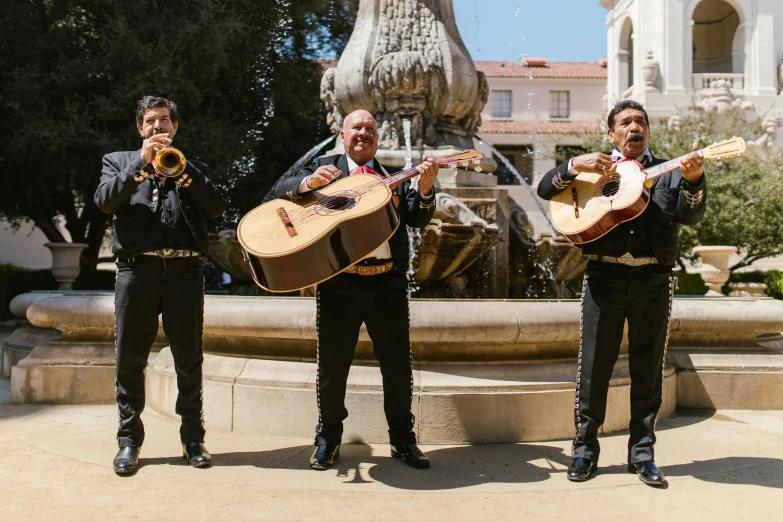 a group of men playing instruments in front of a fountain, an album cover, by Alejandro Obregón, pexels contest winner, mexican mustache, california;, square, 3 doors