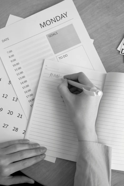 a black and white photo of a person writing in a notebook, female calendar, educational supplies, promo image, multiple stories