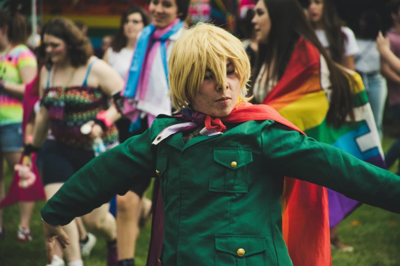 a man that is standing in the grass, an album cover, unsplash, renaissance, pride parade, anime cosplay, crowd of cool people dancing, wearing green jacket