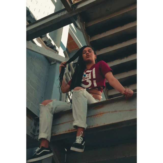 a man sitting on top of a set of stairs, inspired by Eddie Mendoza, instagram, maroon and white, gang clothing, mid 2 0's female, profile image