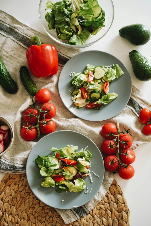 a table topped with plates of food and bowls of vegetables, by Julia Pishtar, cutting a salad, promo image, splento, abcdefghijklmnopqrstuvwxyz