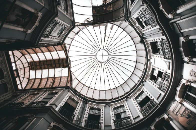 the inside of a building with a skylight, unsplash contest winner, visual art, ((fish eye)), victorian architecture, mexico city, everything enclosed in a circle