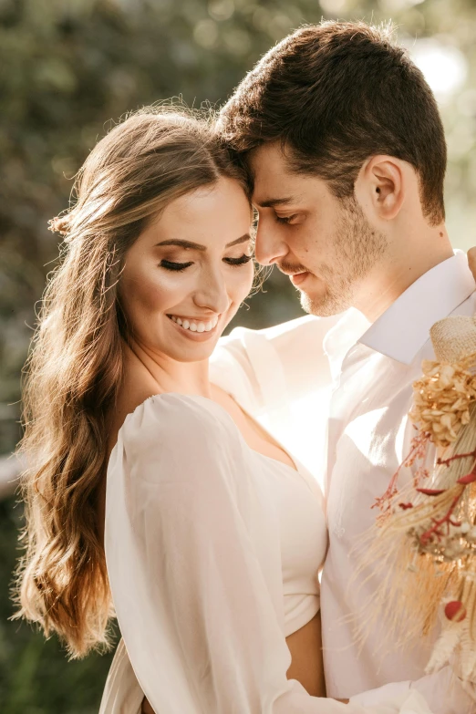 a man and a woman standing next to each other, trending on unsplash, romanticism, soft sun lights, bouquet, long glowing ethereal hair, gold