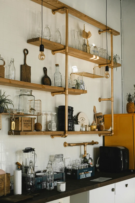 a kitchen filled with lots of wooden shelves, pexels contest winner, modernism, glass and gold pipes, ecommerce photograph, metal works, cafe lighting