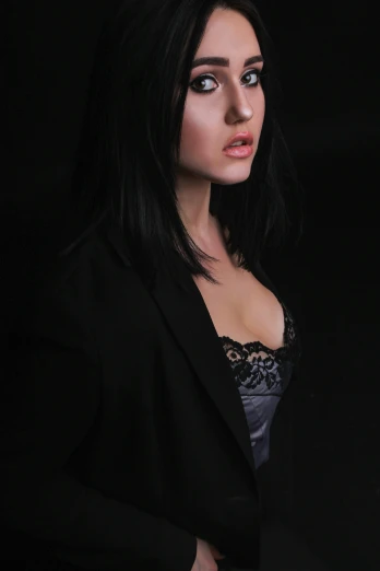 a woman in a black jacket posing for a picture, inspired by Carlo Mense, trending on deviantart, black bra, upscale photo, black hair, indoor picture