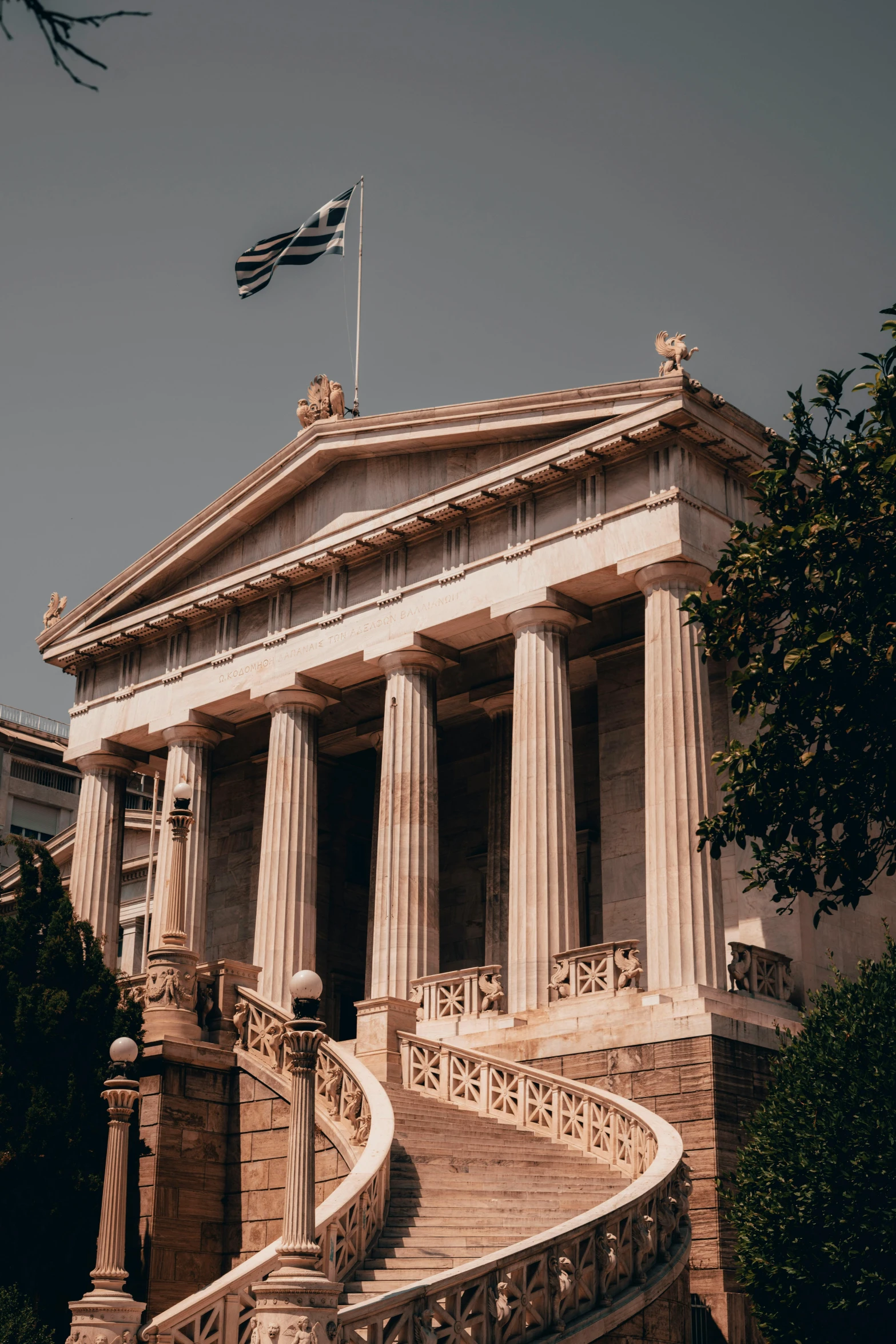 a building with a flag on top of it, pexels contest winner, neoclassicism, huge greek columns, profile image, overview, square