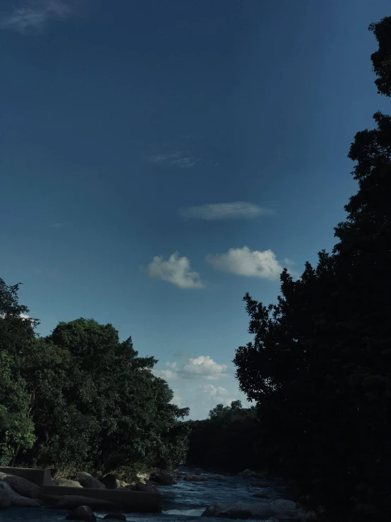 a river running through a lush green forest, an album cover, inspired by Alexander Nasmyth, unsplash, aestheticism, cloud in the sky, ☁🌪🌙👩🏾, from the roof, central park