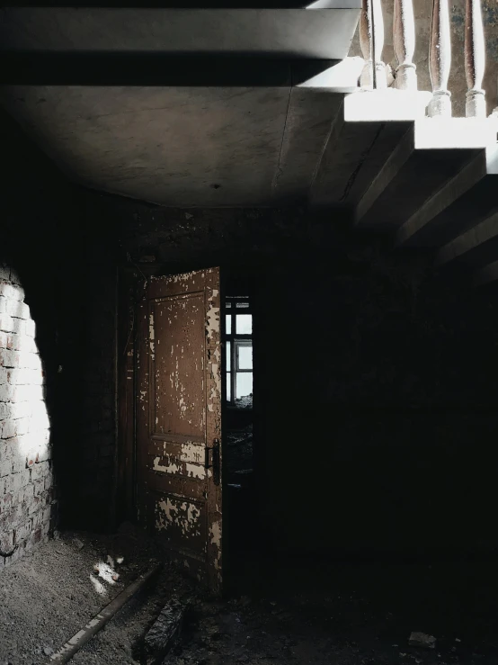 a black and white photo of a set of stairs, an album cover, inspired by Katia Chausheva, pexels contest winner, hashima island, doorway, brown, todd hido