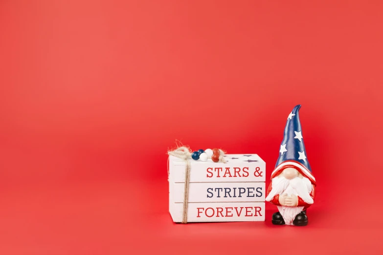 a gnome holding a sign that says stars and stripes forever, a statue, by Andries Stock, shutterstock contest winner, red stripe, miniature product photo, presents, rugged | stars