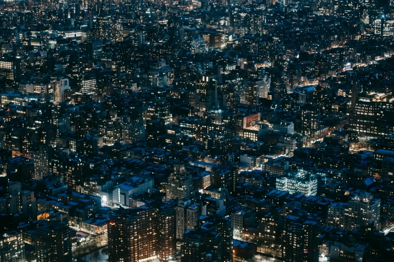 an aerial view of a city at night, by Daniel Lieske, new york buildings, closeup shot, unsplash 4k, japanese city