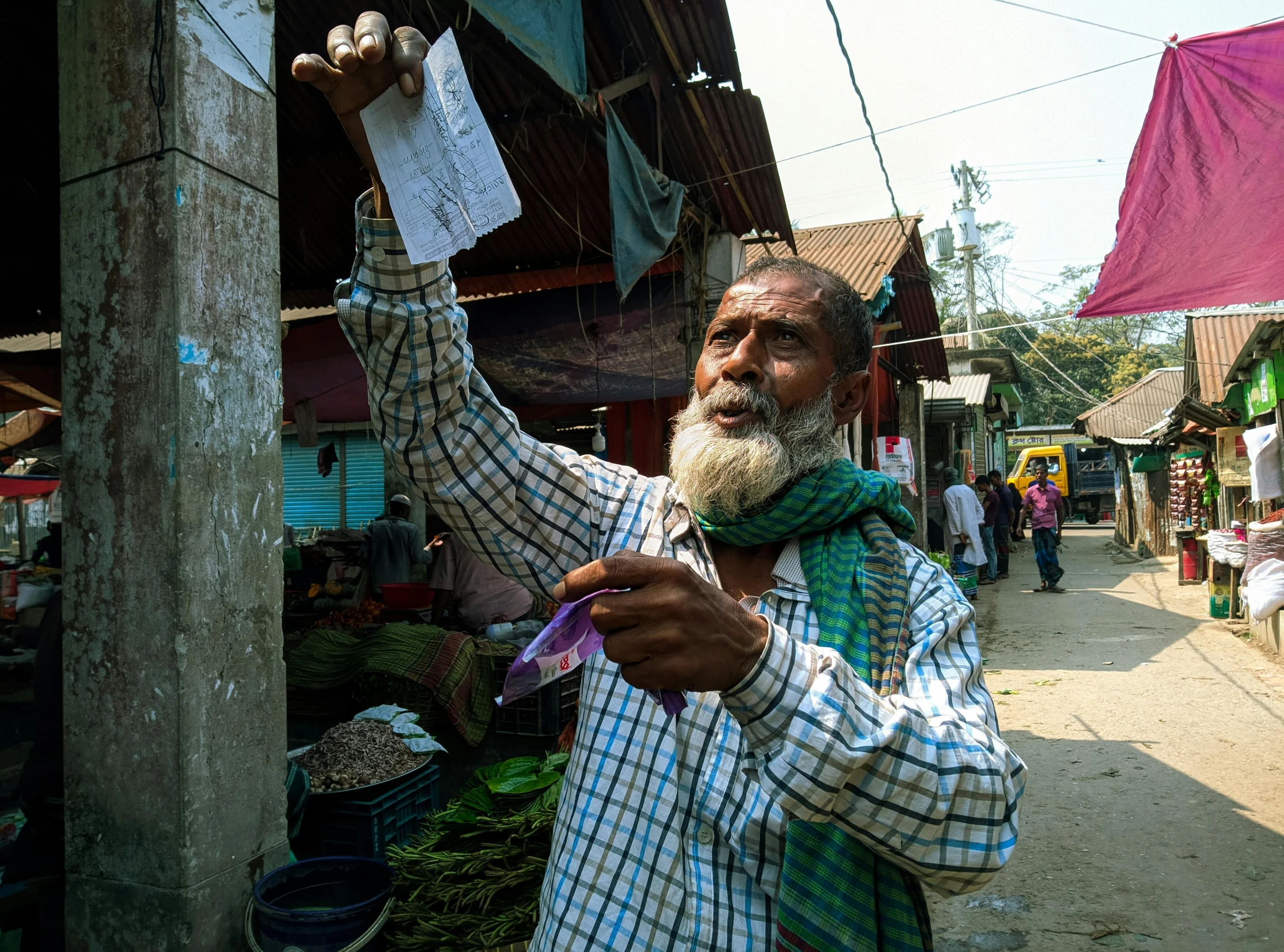 a man holding a piece of paper in his hand, pexels contest winner, bengal school of art, people shopping, tall farmer, thumbnail