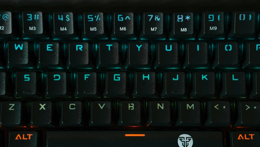 a close up of a computer keyboard with glowing keys, a portrait, trending on cg society, hurufiyya, titanfall irl, teal orange, bottom angle, with glowing runes on the body