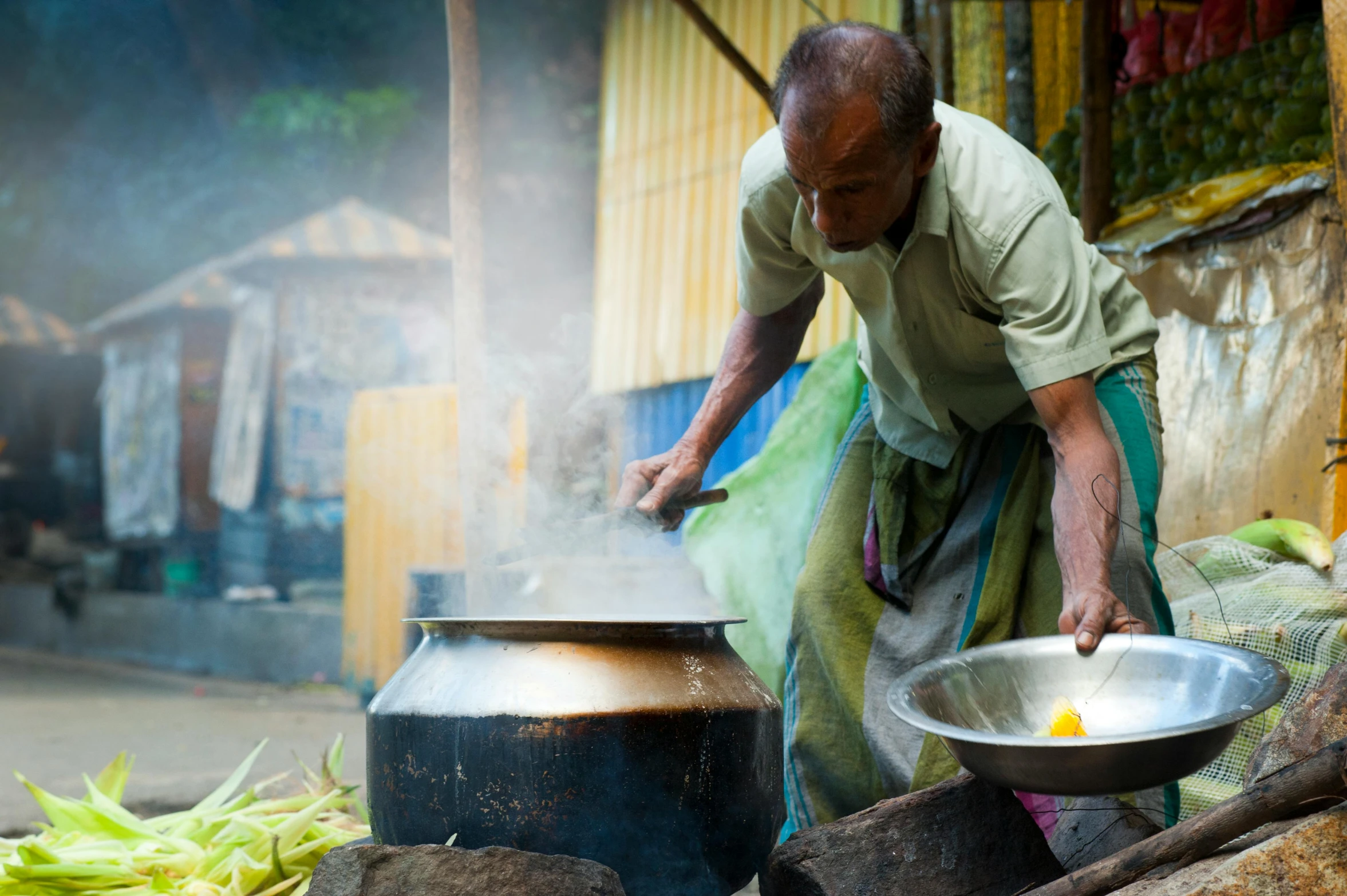 a man that is cooking some kind of food, pexels contest winner, hurufiyya, avatar image, sri lanka, thumbnail, exterior shot