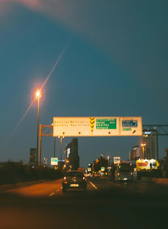 a city street filled with lots of traffic at night, an album cover, by Jacob Toorenvliet, hurufiyya, advertising billboard, freeway, 3 5 mm photo, billboard image