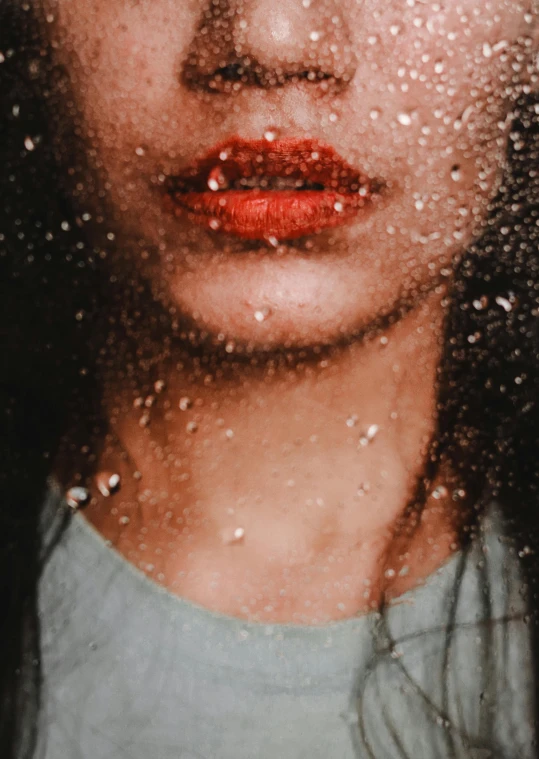 a close up of a woman's face through a window, a picture, inspired by Elsa Bleda, trending on pexels, serial art, wet mouth, glitter gif, snow on the body, lipstick