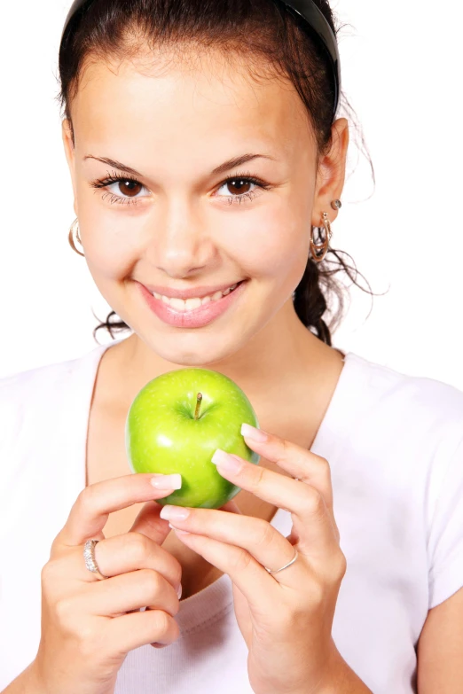 a woman holding a green apple in front of her face, a digital rendering, shutterstock, 2 5 6 x 2 5 6 pixels, snacks, no