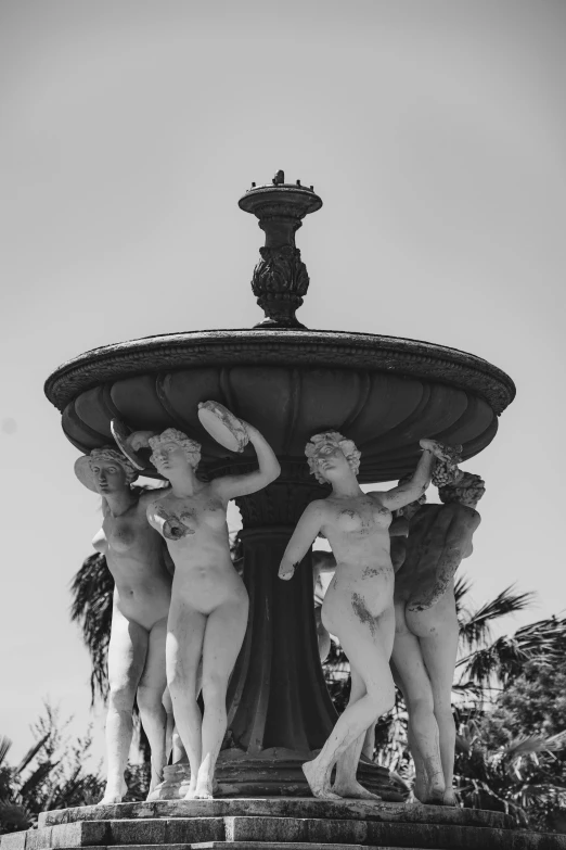 a black and white photo of a fountain, by Cherryl Fountain, female bodies, at the seaside, putti, very aesthetic