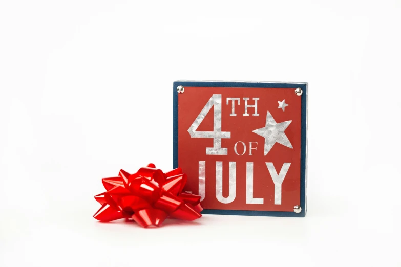 a red, white and blue fourth of july sign next to a red bow, a picture, miniature product photo, 3 4 5 3 1, mint, item