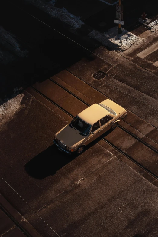 a car is parked on the side of the road, pexels contest winner, photorealism, volumetric light from above, square, clemens ascher, cold light