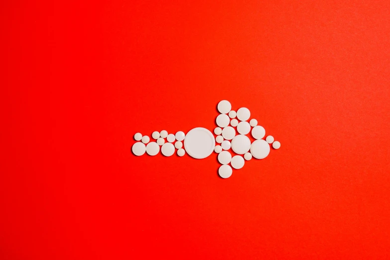 pills on a red background, by Damien Hirst, unsplash, kinetic pointillism, curved red arrow, detailed white liquid, red dot, different sizes