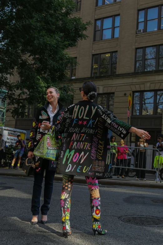 a couple of people that are walking down the street, by Nina Hamnett, happening, holy themed, in new york, colourful clothing, placards