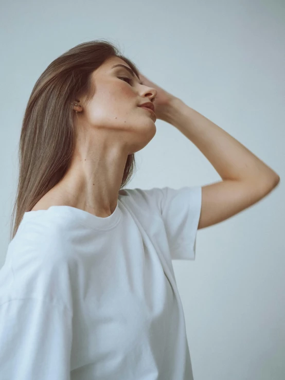 a woman in a white shirt with her eyes closed, by Adam Marczyński, trending on unsplash, aestheticism, bust with a very long neck, t pose, straight stiff dry damaged hair, coughing