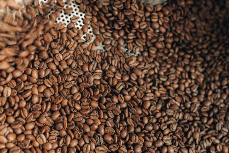 a pile of coffee beans sitting on top of a table, by Daniel Lieske, trending on unsplash, hurufiyya, 1024x1024, fan favorite, background image, stroopwaffel