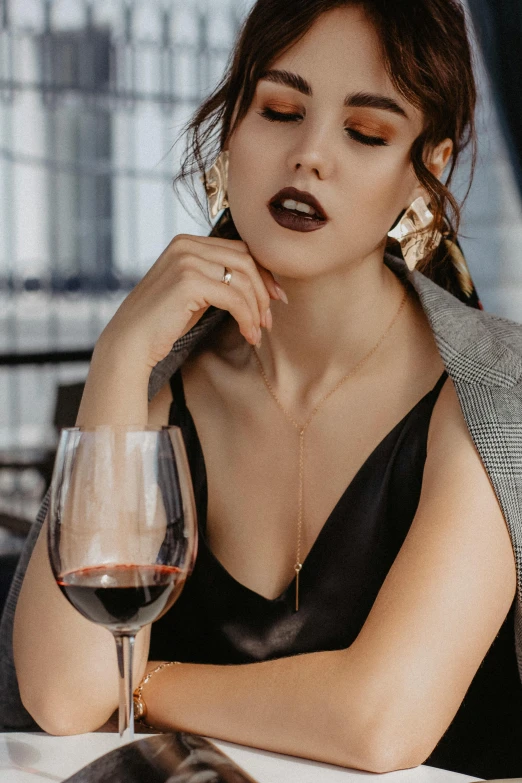 a woman sitting at a table with a glass of wine, a portrait, trending on pexels, luxurious neckless, long neck, extremely graphic, up close
