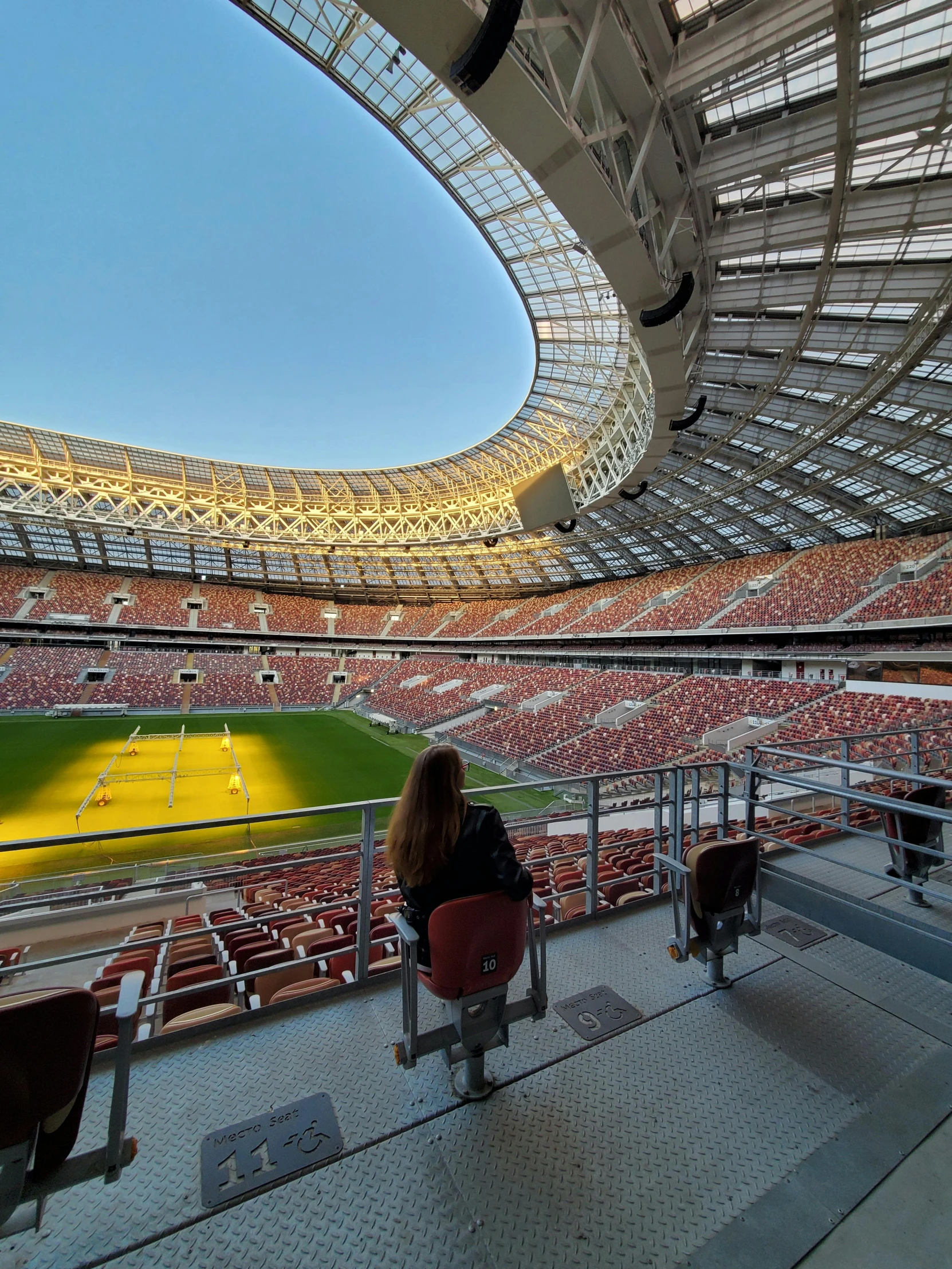 a stadium filled with lots of people sitting next to each other, russian architecture, profile image, window view, brown