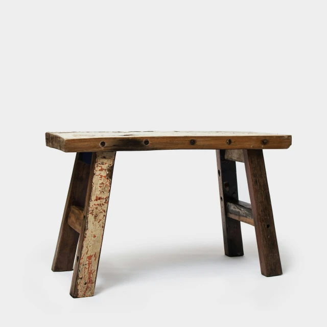 a wooden bench sitting on top of a white floor, sitting on a stool, on a rough wooden dungeon table, medium wide front shot, h 9 6 0