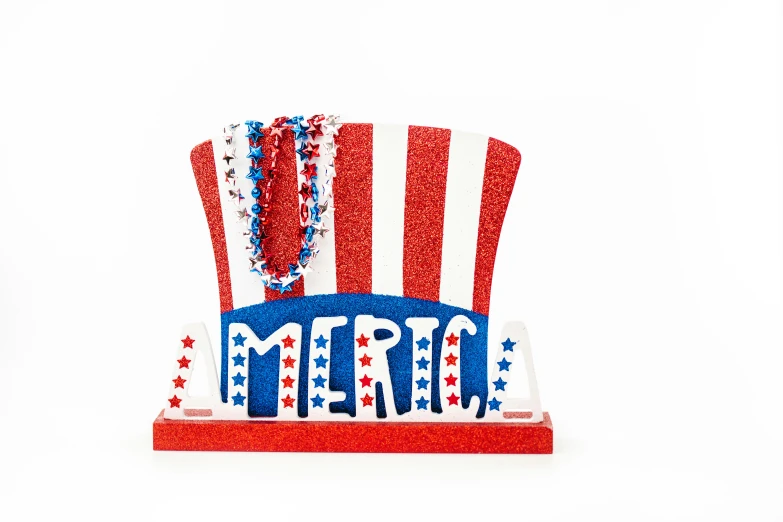 a red, white and blue top hat sitting on top of a table, a picture, inspired by Americo Makk, laser cut, glitter, detailed product image, at home