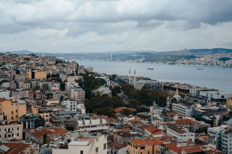 a view of a city from the top of a hill, pexels contest winner, hurufiyya, mixture turkish and russian, nice slight overcast weather, demna gvasalia, brown