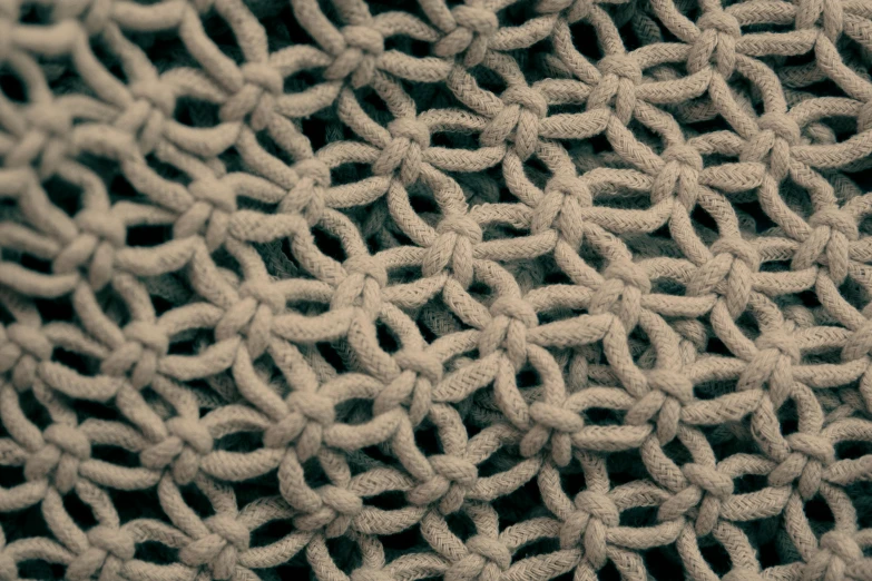 a close up of a knitted cloth, a digital rendering, inspired by Ai Weiwei, unsplash, webs, wallpaper”, shibari, circle