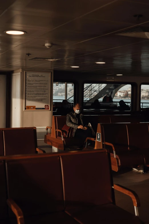 a couple of brown chairs sitting next to each other, by Daniel Seghers, pexels contest winner, ship interior, photo of a man, passengers, thumbnail