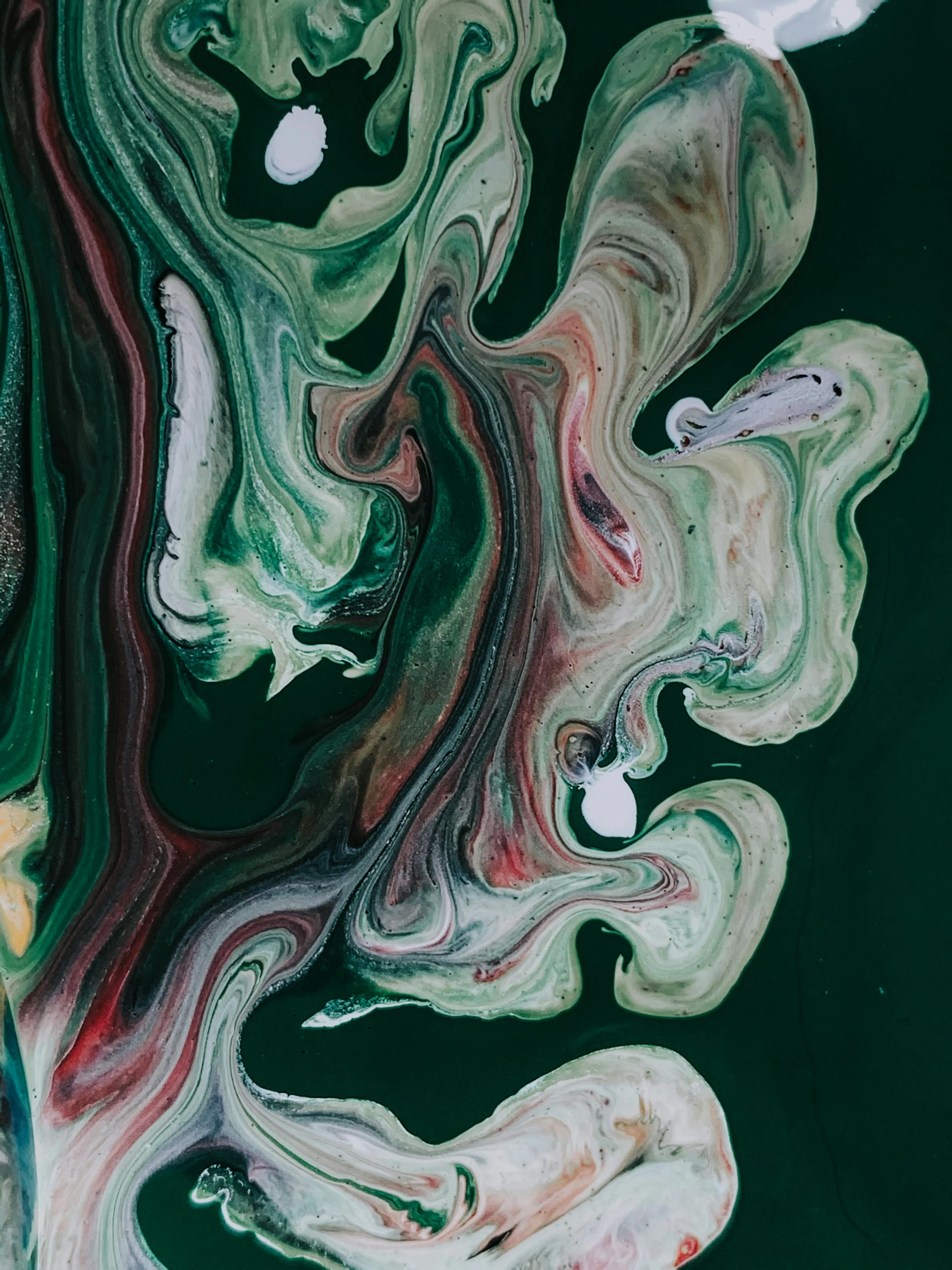 a close up of a painting on a wall, an abstract painting, inspired by Art Green, trending on pexels, made of liquid, malachite, ilustration, colour photo