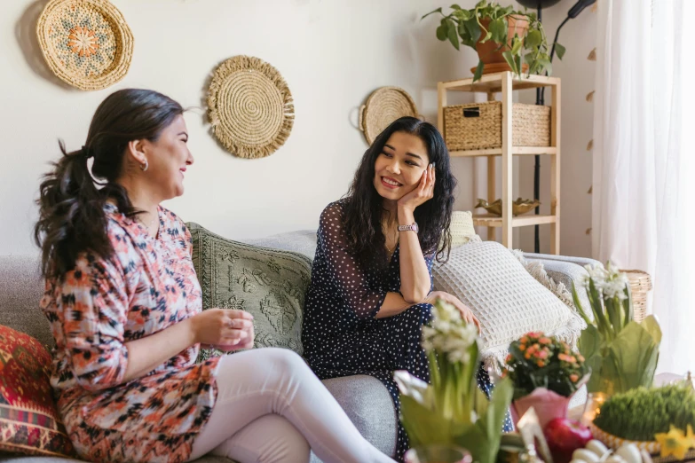 two women sitting on a couch in a living room, pexels contest winner, happening, promotional image, happy friend, profile image, on a white table