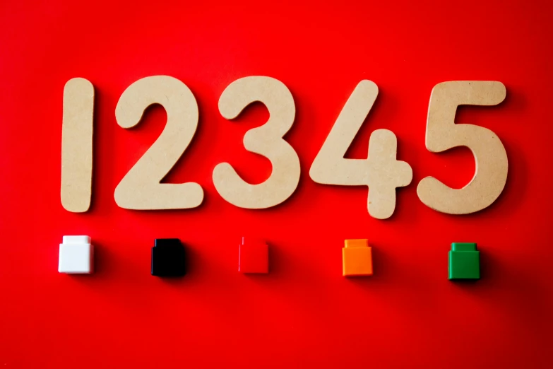 a number made out of wooden blocks on a red background, by Julia Pishtar, trending on unsplash, dials, 1 8 3 4, school class, 1 3 3 4 building