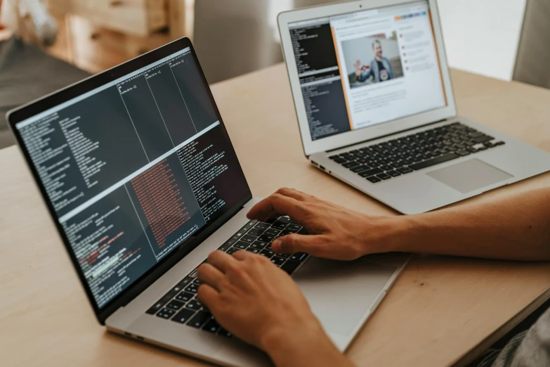 two laptop computers sitting on top of a wooden table, trending on pexels, future coder looking on, beautiful code, 9 9 designs, thumbnail