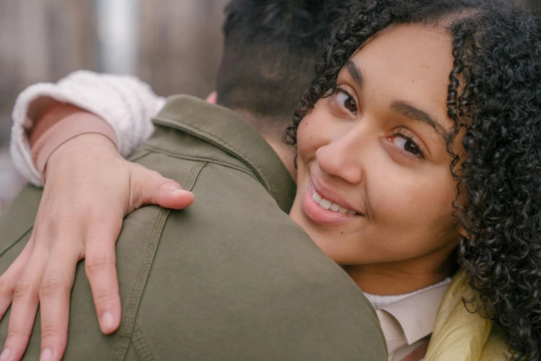 a close up of a person hugging a person, trending on pexels, happening, mixed-race woman, promotional image, sydney park, supportive