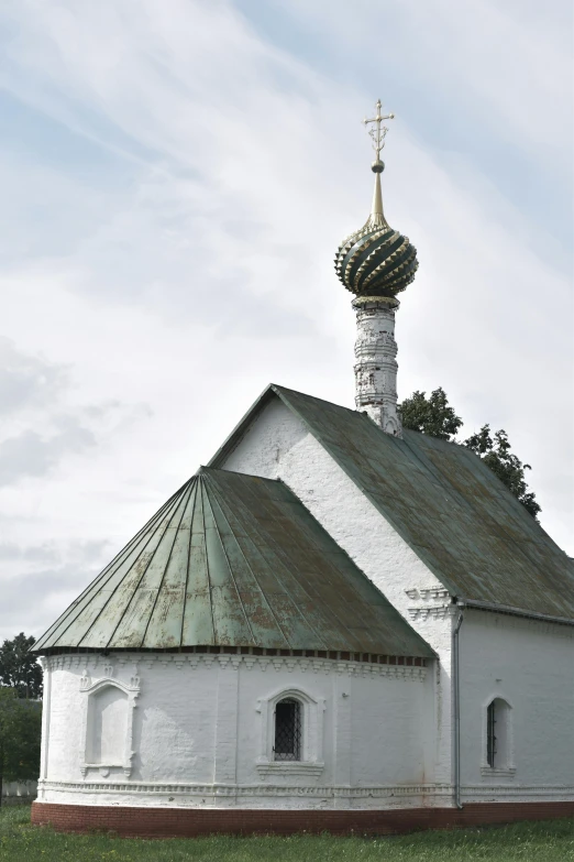 a small white church sitting on top of a lush green field, inspired by Illarion Pryanishnikov, renaissance, rounded roof, pine, photograph, silver