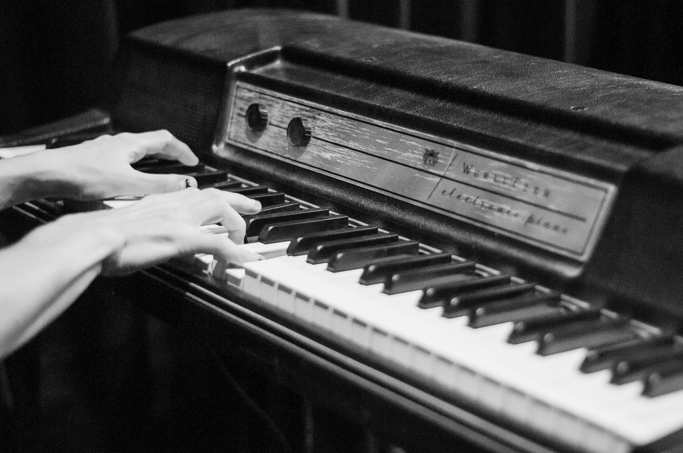 a close up of a person playing a piano