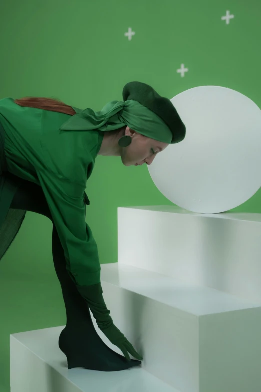 a man that is standing on some steps, inspired by Art Green, video art, green hat, showstudio, a sorceress casting a ice ball, green square