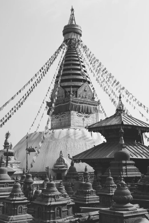 a black and white photo of a buddhist temple, hurufiyya, hight decorated, pitt, domes, julia sarda