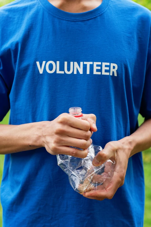 a man in a blue shirt holding a plastic bottle, by Francis Helps, shutterstock, graffiti, wearing a vest top, blue uniform, health supporter, ripple