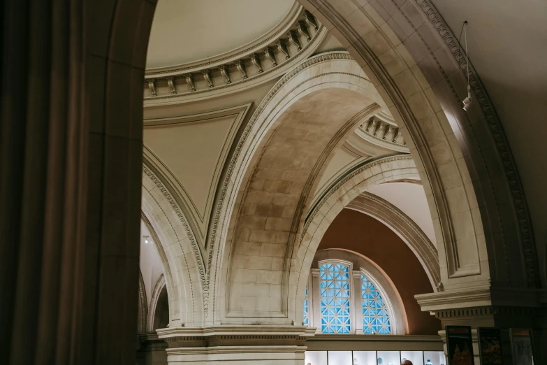 a couple of people that are standing in a building, a marble sculpture, inspired by Sydney Prior Hall, trending on unsplash, high arched ceiling, victorian arcs of sand, metropolitan museum photo, 2 5 6 x 2 5 6 pixels
