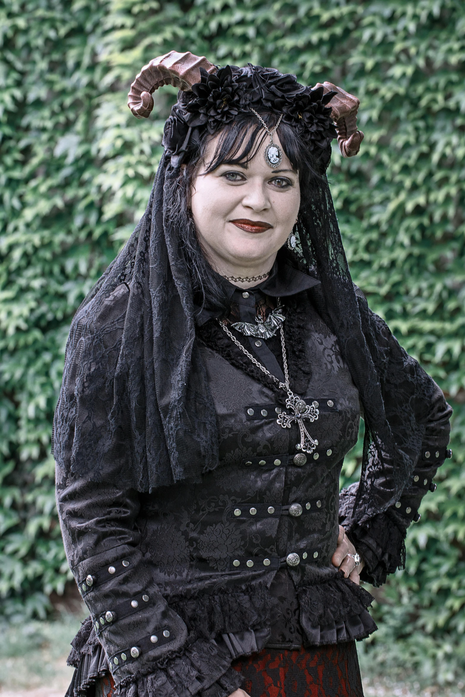 a woman dressed in gothic clothing posing for a picture, profile image, looking happy, wearing ornate clothing, black tendrils